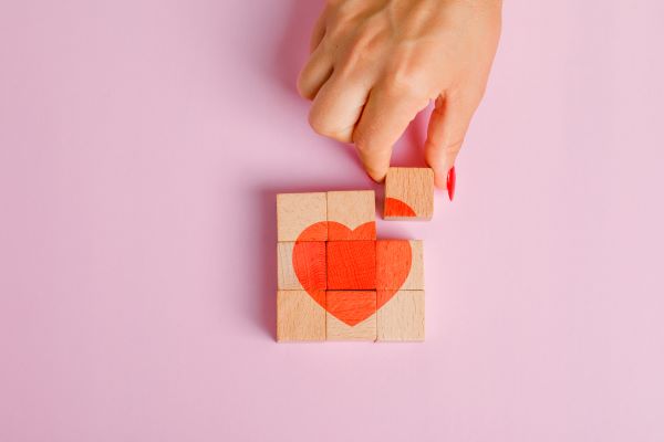 squares of building blocks with a heart shape on them